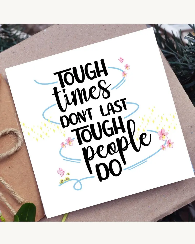 A white greeting card with the text "TOUGH times DON'T LAST TOUGH people DO" in black script. The ca