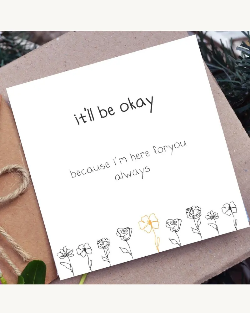 A white card with the text "it'll be okay" and "because I'm here for you always". The card features 