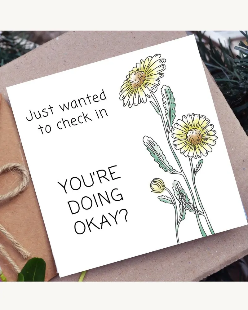 White greeting card with the text "Just wanted to check in, YOU'RE DOING OKAY?" and a watercolor ill