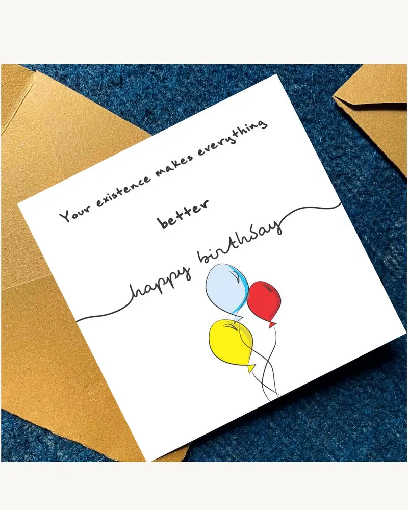 A white birthday card with the message "Your existence makes everything better" and "happy birthday"