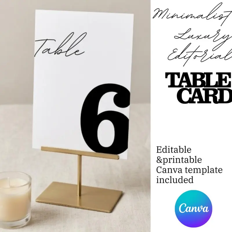 A white table card with the number 6 in black, displayed in a gold metal stand. The word "Table" is 