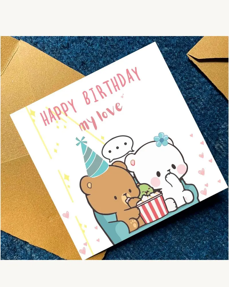 A birthday card with the text "HAPPY BIRTHDAY my love" in pink. The card features cartoon bears, one