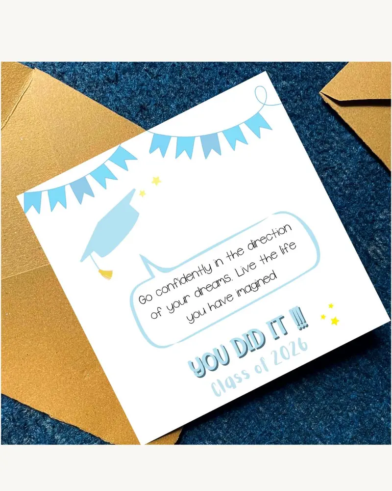 A graduation card featuring a light blue mortarboard illustration and banner. The card reads "Go con