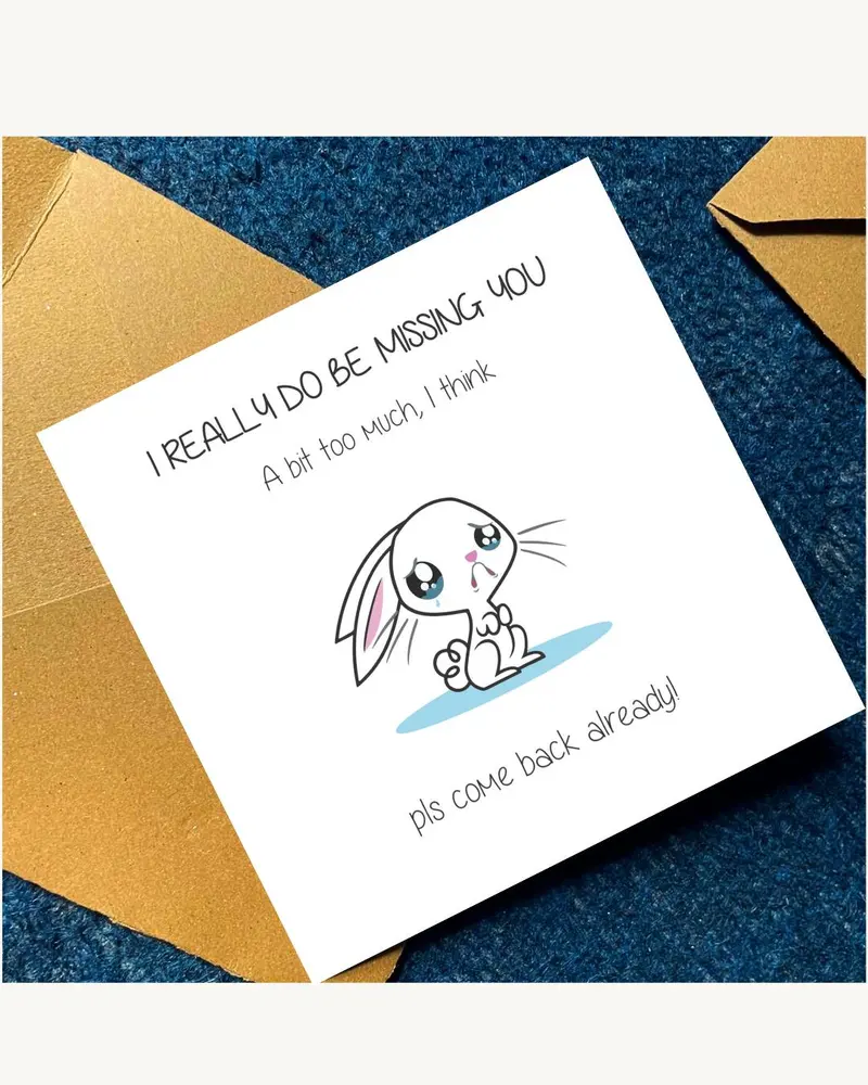 A square white greeting card featuring a cartoon illustration of a sad, crying white rabbit with pin